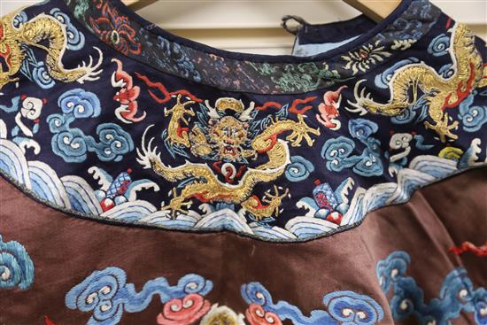 A Chinese embroidered silk and gold thread dragon jacket, late Qing dynasty, alterations